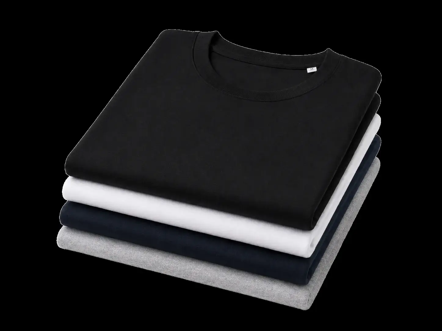 Stack of folded plain T-shirts in black, white and grey